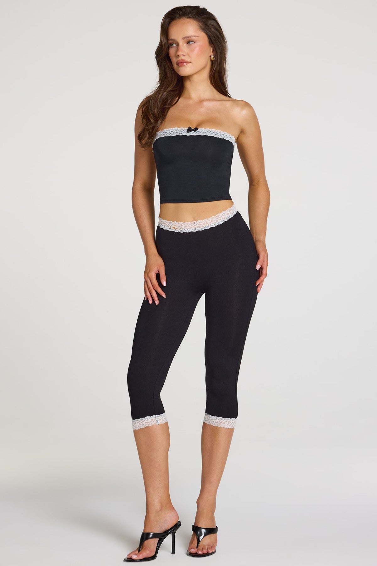Modal Lace-Trim Mid-Rise Capri Leggings in Black — front view, close
