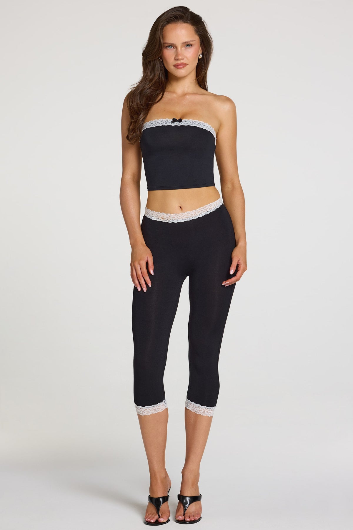 Modal Lace-Trim Mid-Rise Capri Leggings in Black — front view