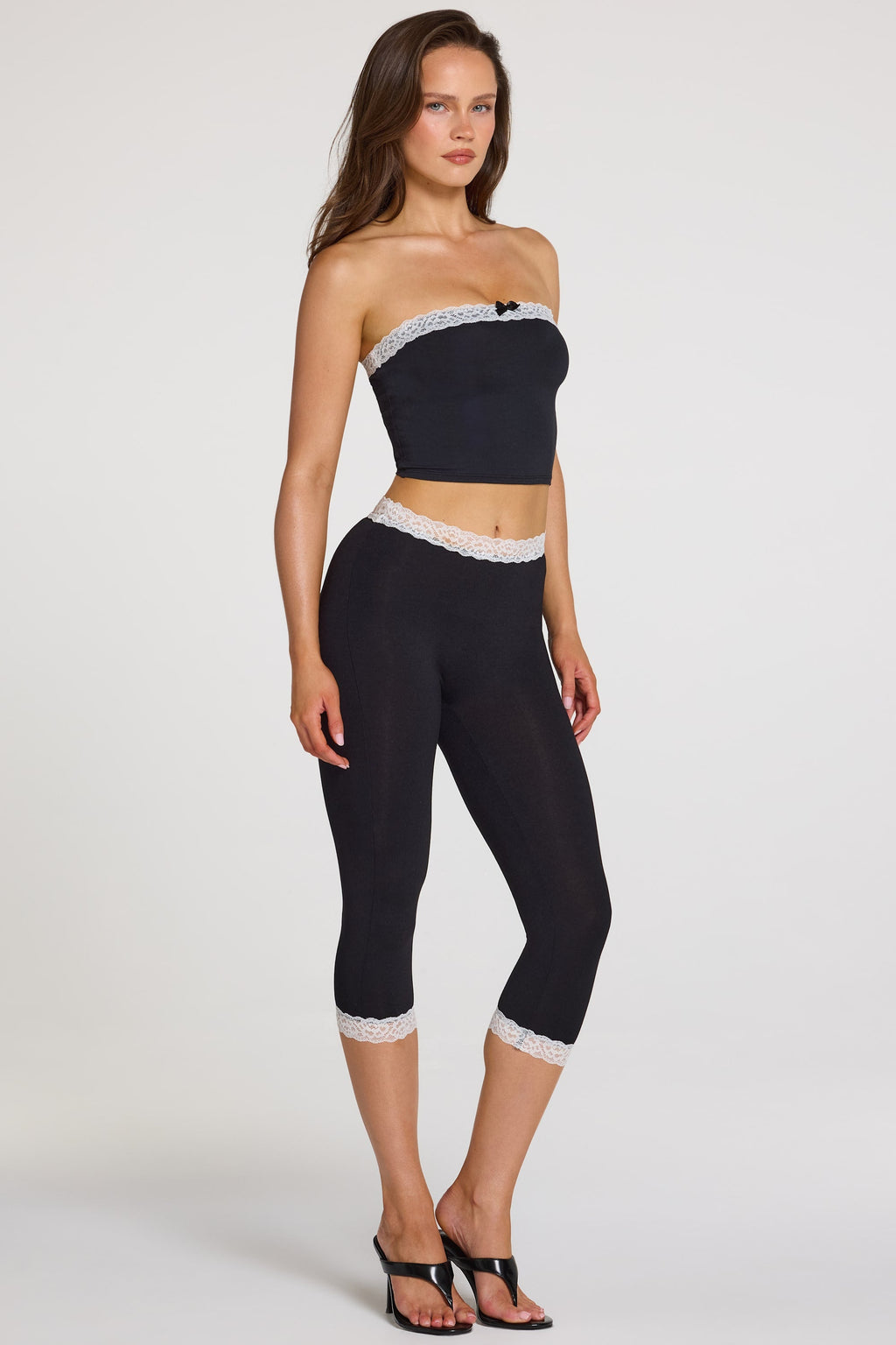Modal Lace-Trim Mid-Rise Capri Leggings in Black — three-quarter view
