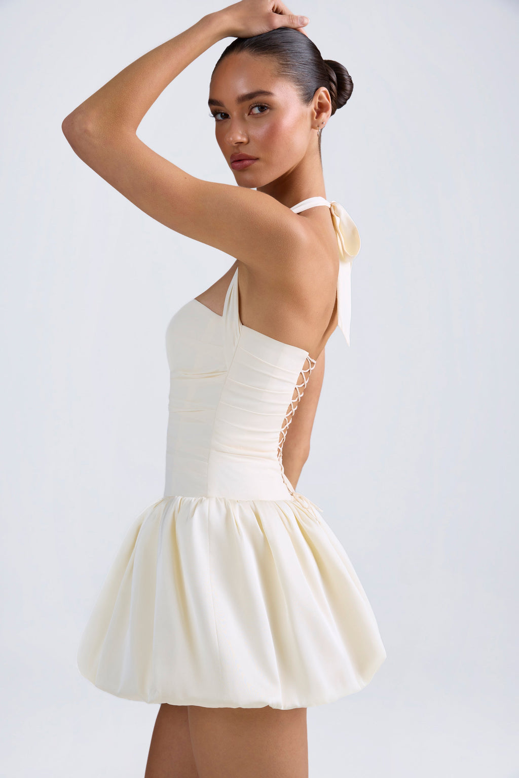 Lace-Up Bubble Hem Corset Mini Dress in Ivory — on model