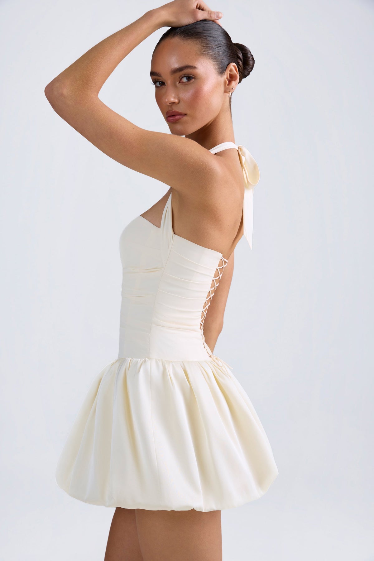 Lace-Up Bubble Hem Corset Mini Dress in Ivory — on model