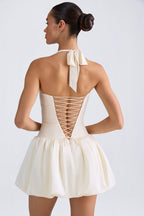 Lace-Up Bubble Hem Corset Mini Dress in Ivory — back view