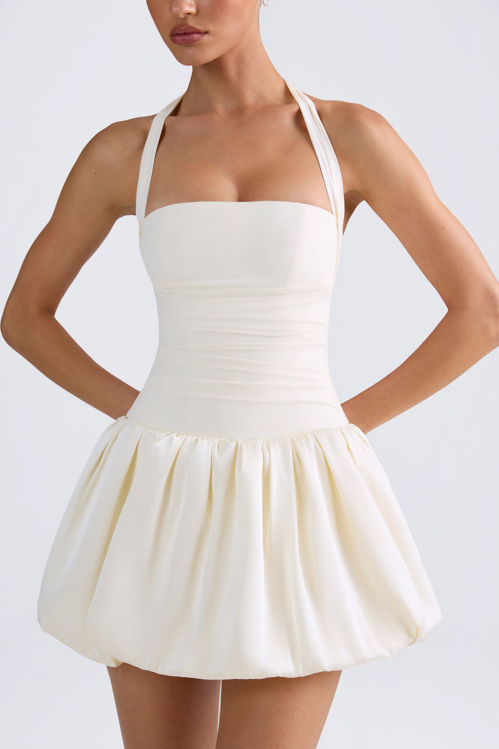 Lace-Up Bubble Hem Corset Mini Dress in Ivory — three-quarter view