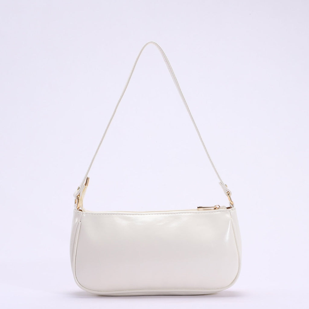 Primrose pastel floral embroidery shoulder bag in white — side view