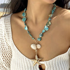 Coastal Shell & Starfish Necklace in blue — on model