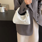 Camille blossom silk-look shoulder bag in white — on model