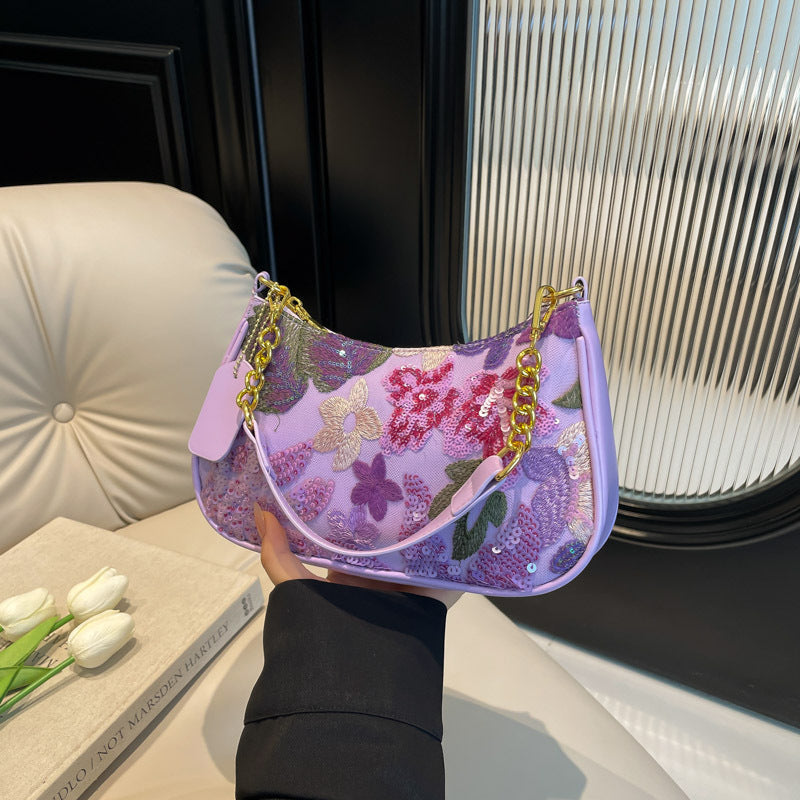 Elodie floral sequin shoulder bag in purple — on model