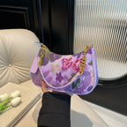 Elodie floral sequin shoulder bag in purple — on model