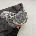 Amelie faux-pearl heart shoulder bag in silver — on model