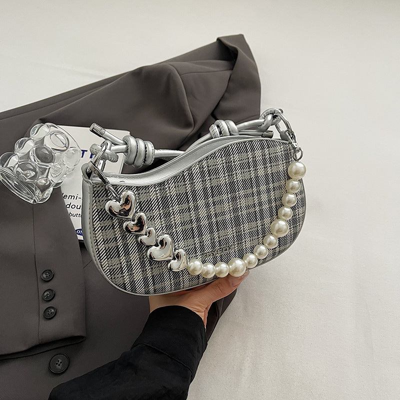 Amelie faux-pearl heart shoulder bag in silver — on model