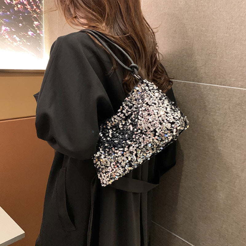 Giselle sequin shoulder bag in silver — on model