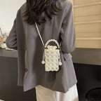 Perla faux-pearl mini crossbody bag in ivory — on model, back view