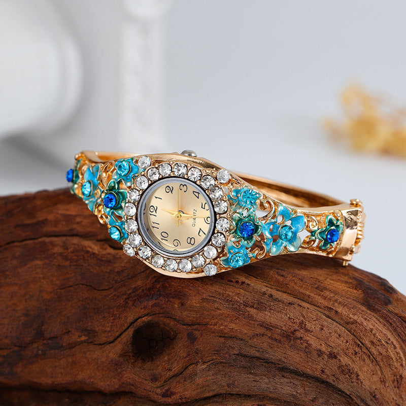 Floral Crystal Bangle Watch in blue — front view