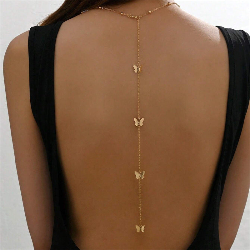 Butterfly Back Drop Necklace — back view on model
