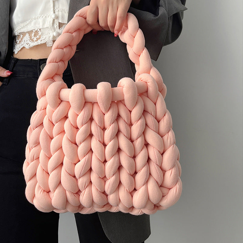 Ottilie woven tote bag in light pink — on model