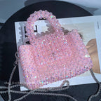Esme crystal-bead mini bag in light pink — styled
