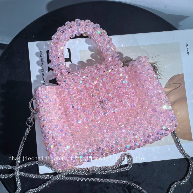 Esme crystal-bead mini bag in light pink — styled