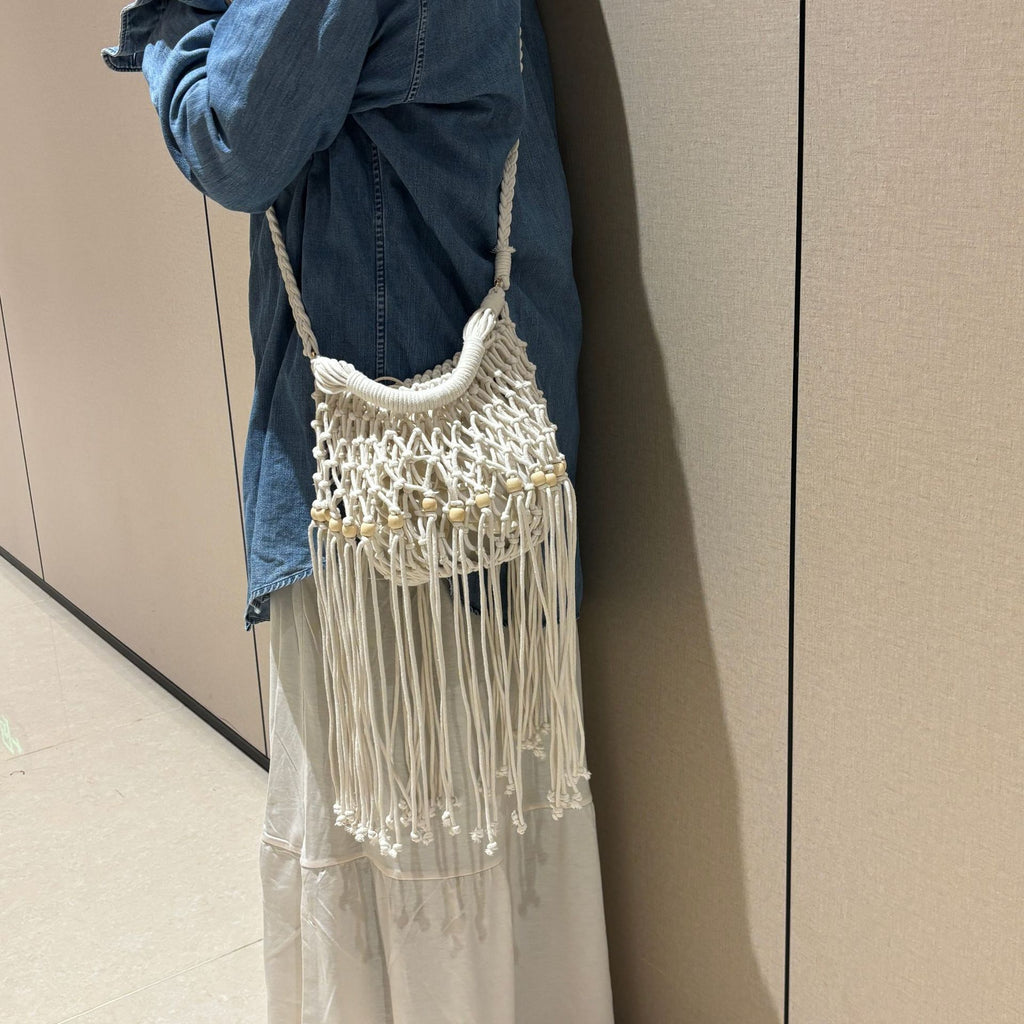Juniper fringe crochet bag in milk — on model