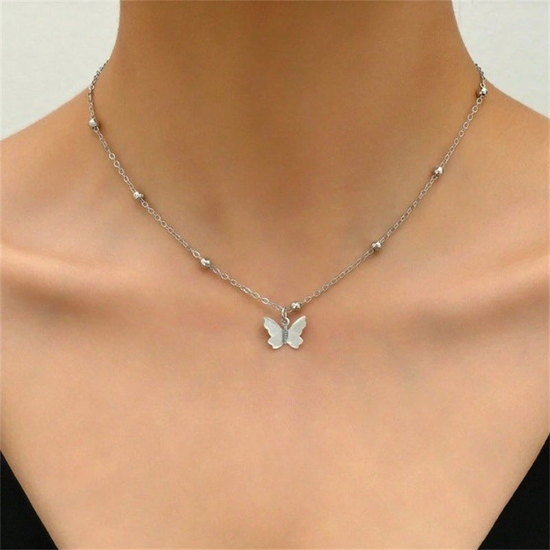 Butterfly Back Drop Necklace — front view on model