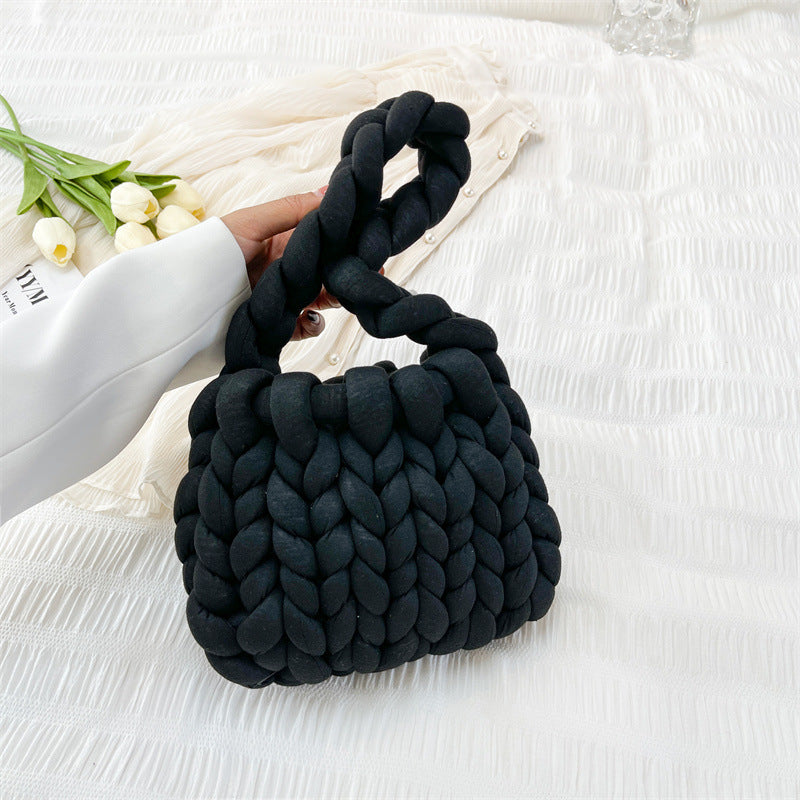 Ottilie woven tote bag in black — three-quarter view