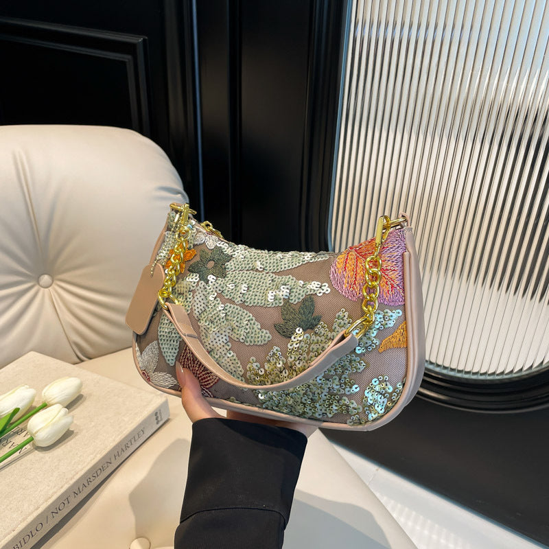 Elodie floral sequin shoulder bag — on model, detail