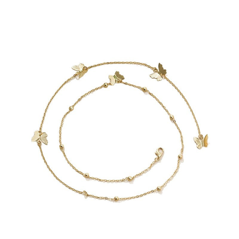 Butterfly Back Drop Necklace in Gold and Silver — flat lay