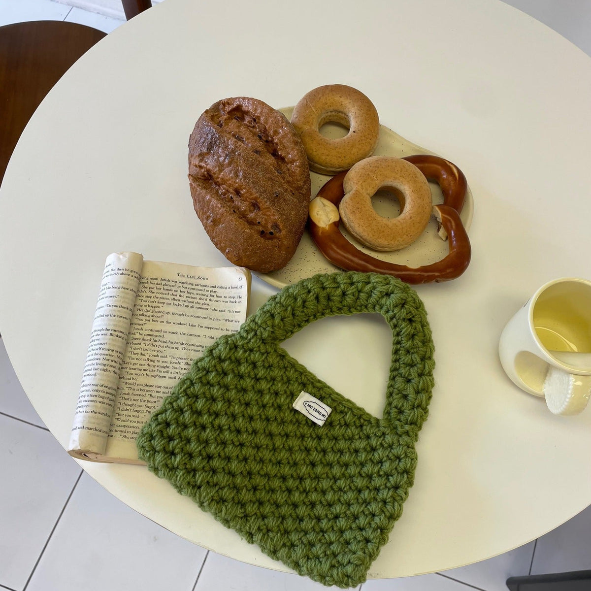 Wren crochet mini tote bag in military green — styled