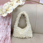Vivienne vintage-style faux-pearl handbag in ivory — styled