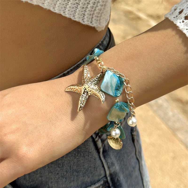 Coastal Shell & Starfish Bracelet in blue — on model