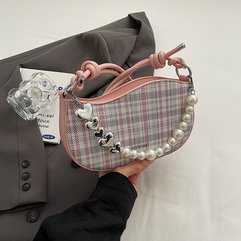 Amelie faux-pearl heart shoulder bag in pink — on model