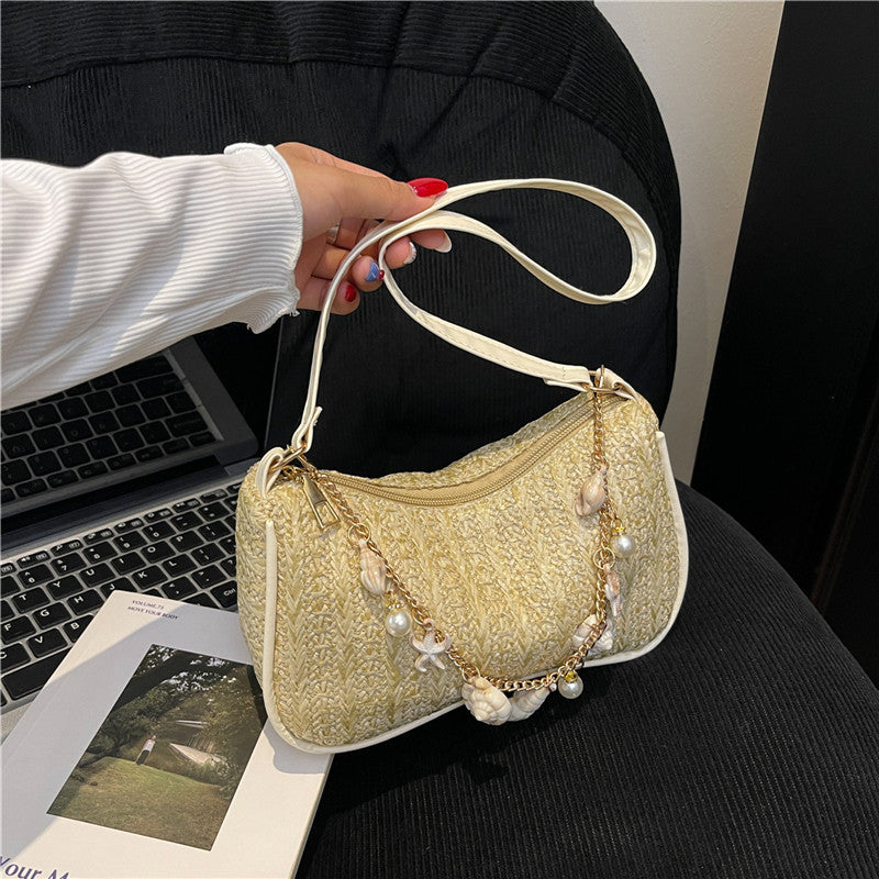 Florence pearl charm shoulder bag in dark beige — on model