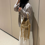 Juniper fringe crochet bag in beige — on model