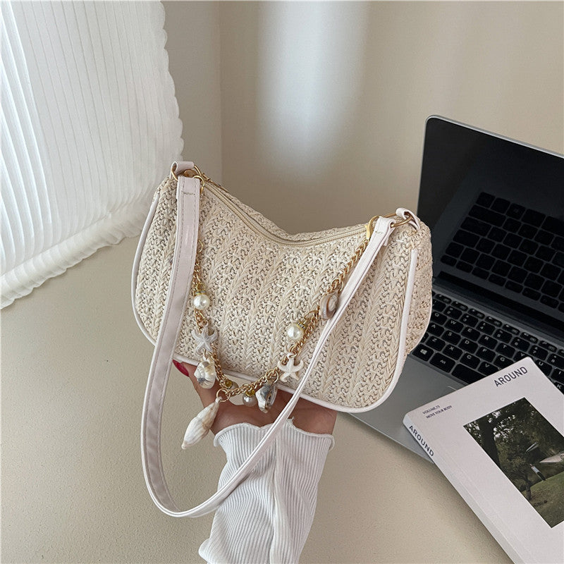 Florence pearl charm shoulder bag in beige — styled