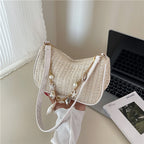 Florence pearl charm shoulder bag in beige — styled