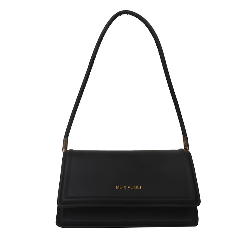 Harriet minimalist structured shoulder bag in black — side view