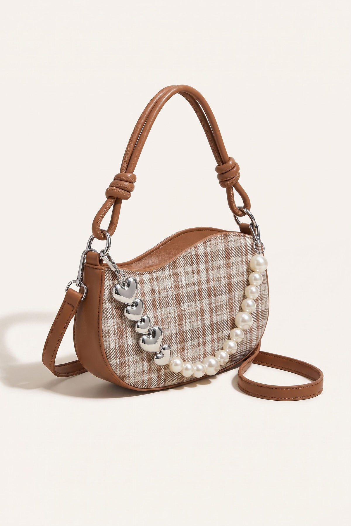 Amelie faux-pearl heart shoulder bag in brown — three-quarter view