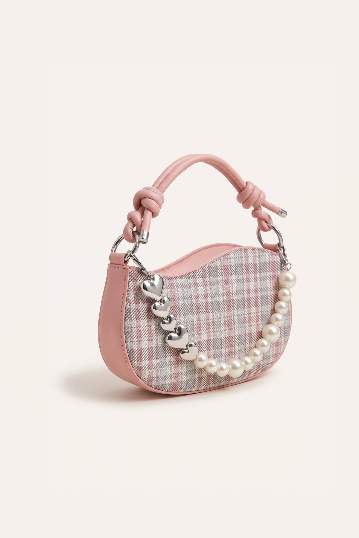 Amelie faux-pearl heart shoulder bag in pink — three-quarter view
