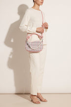 Amelie faux-pearl heart shoulder bag in pink — on model