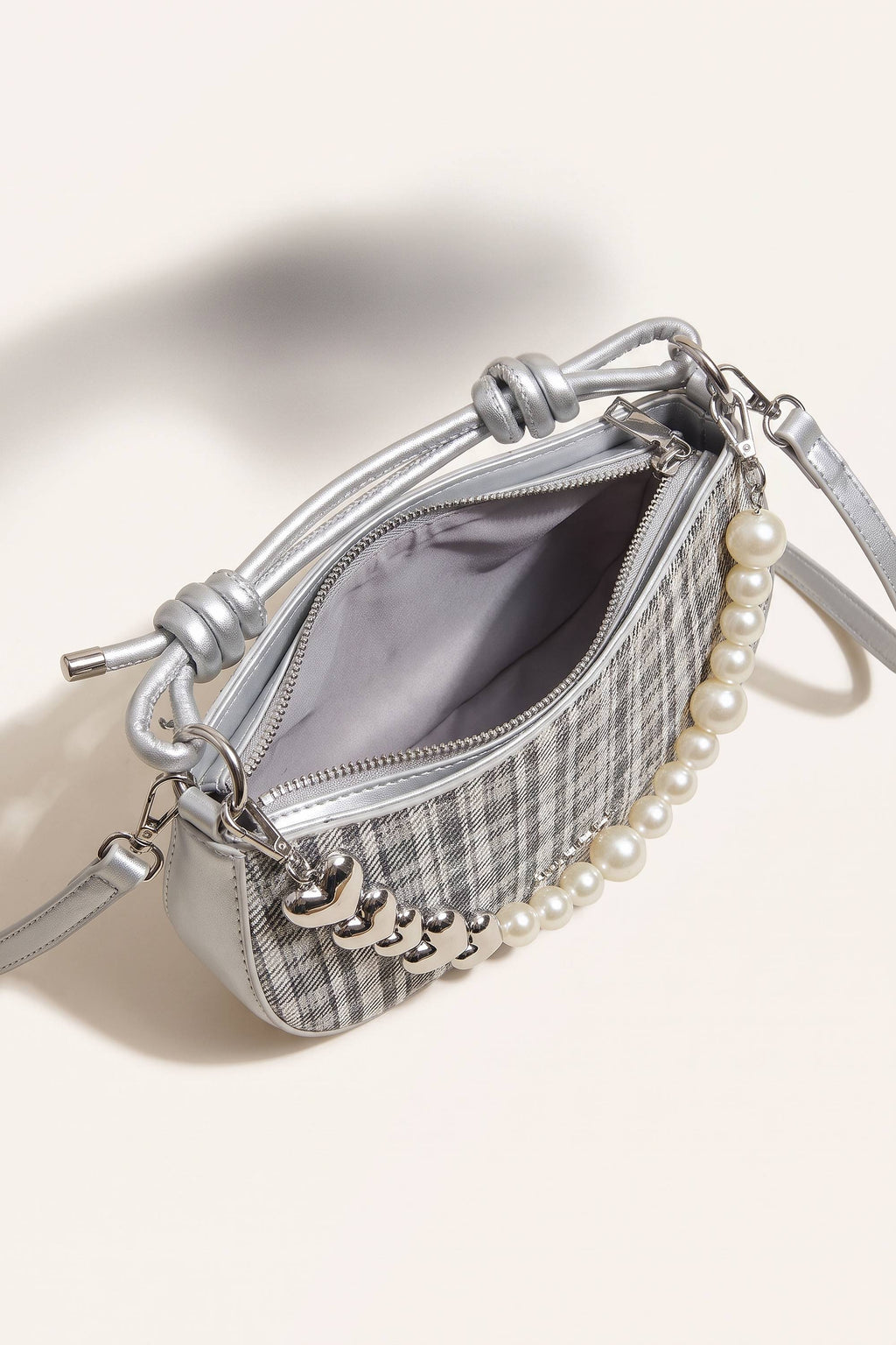 Amelie faux-pearl heart shoulder bag in silver — on model