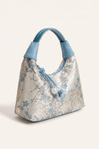 Camille blossom silk-look shoulder bag in Blue — three-quarter view