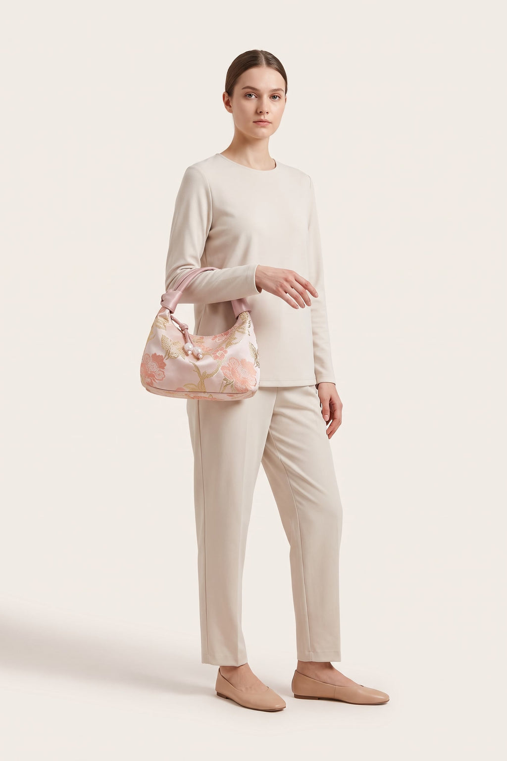 Camille blossom silk-look shoulder bag in light pink — on model