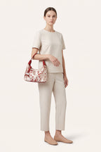 Camille blossom silk-look shoulder bag in Red — on model