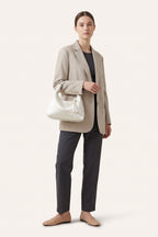 Camille blossom silk-look shoulder bag in White — on model