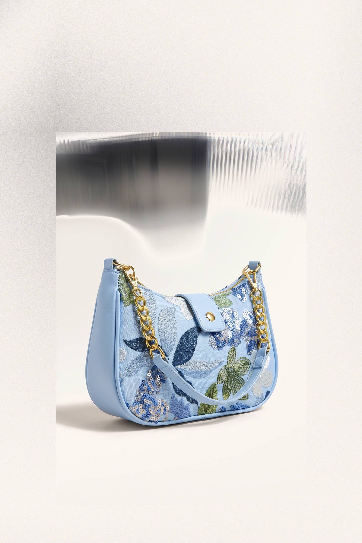 Elodie Shoulder Bag in Blue — three-quarter view
