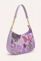 Elodie floral sequin shoulder bag in Purple — three-quarter view