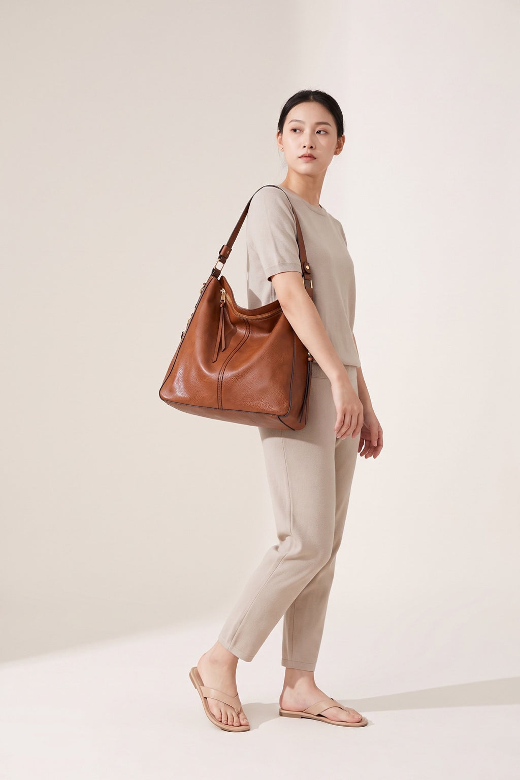 Genevieve hobo bag in brown — on model