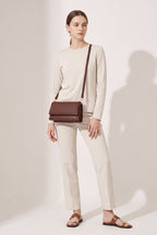 Harriet shoulder bag in brown — on model