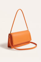 Harriet shoulder bag in orange — three-quarter view