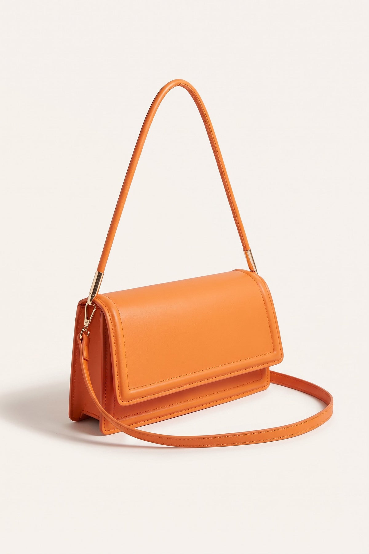 Harriet shoulder bag in orange — three-quarter view