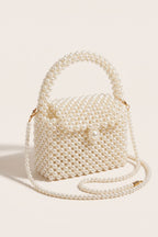 Iris mini bag in ivory — three-quarter view